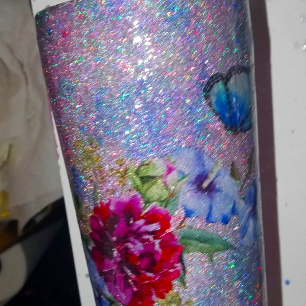 Custom handmade tumbler made by Carrie glitter blue with tattoo added